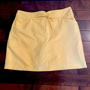 Izod golf skirt with inner shorts, yellow. Women’s size 12